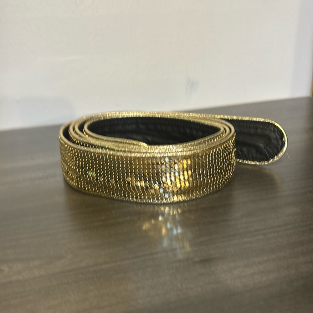 Gold Lame belt with black leather back.